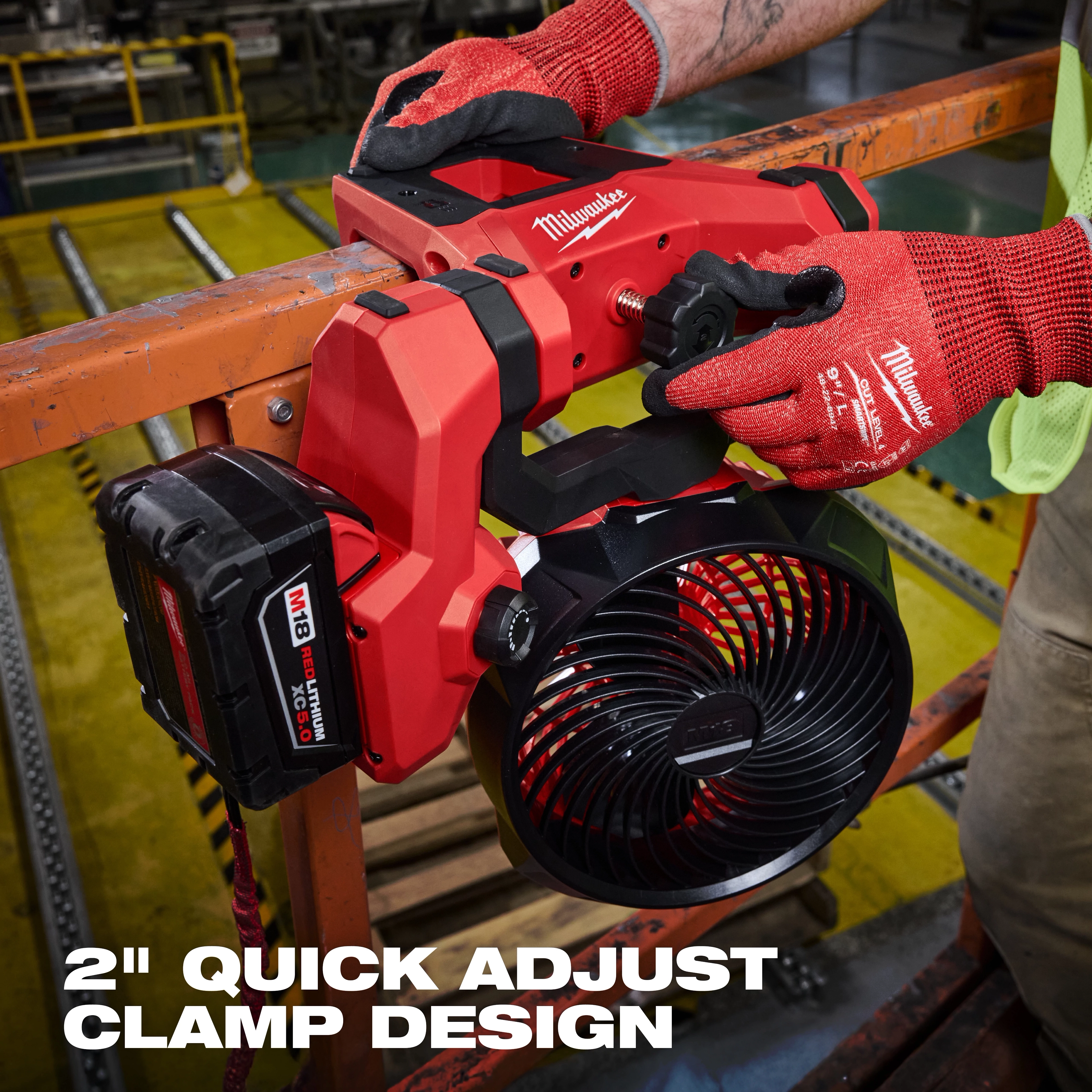 M18 Brushless Scissor Lift Fan with 2" quick adjust clamp design, shown being operated by a person wearing red gloves.
