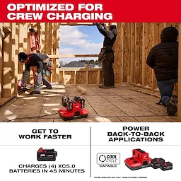 M18 & M12 Four Bay Simultaneous Super Charger w/ PACKOUT Compatibility on a construction site floor with workers framing walls
