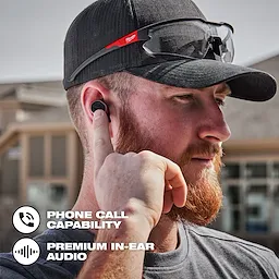 Worker on the jobsite using the Bluetooth ear buds to make a phone call
