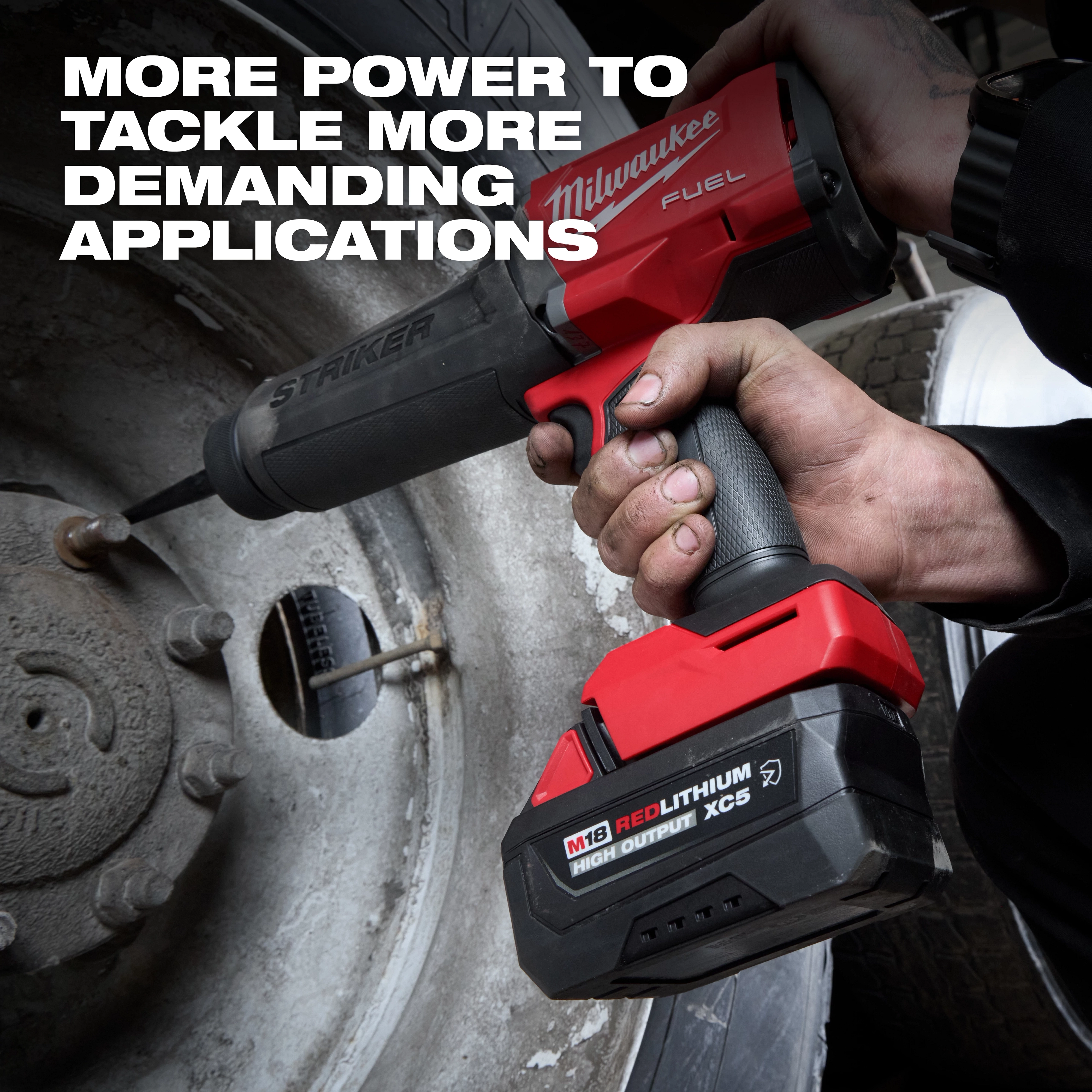 Hand using power tool with M18 REDLITHIUM HIGH OUTPUT XC5 Resistant Battery Pack on a vehicle wheel.