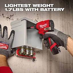 A person wearing Milwaukee gloves uses a Milwaukee cordless screwdriver to work on an electrical box mounted on a concrete wall. Text at the top reads, "LIGHTEST WEIGHT 1.7LBS WITH BATTERY."