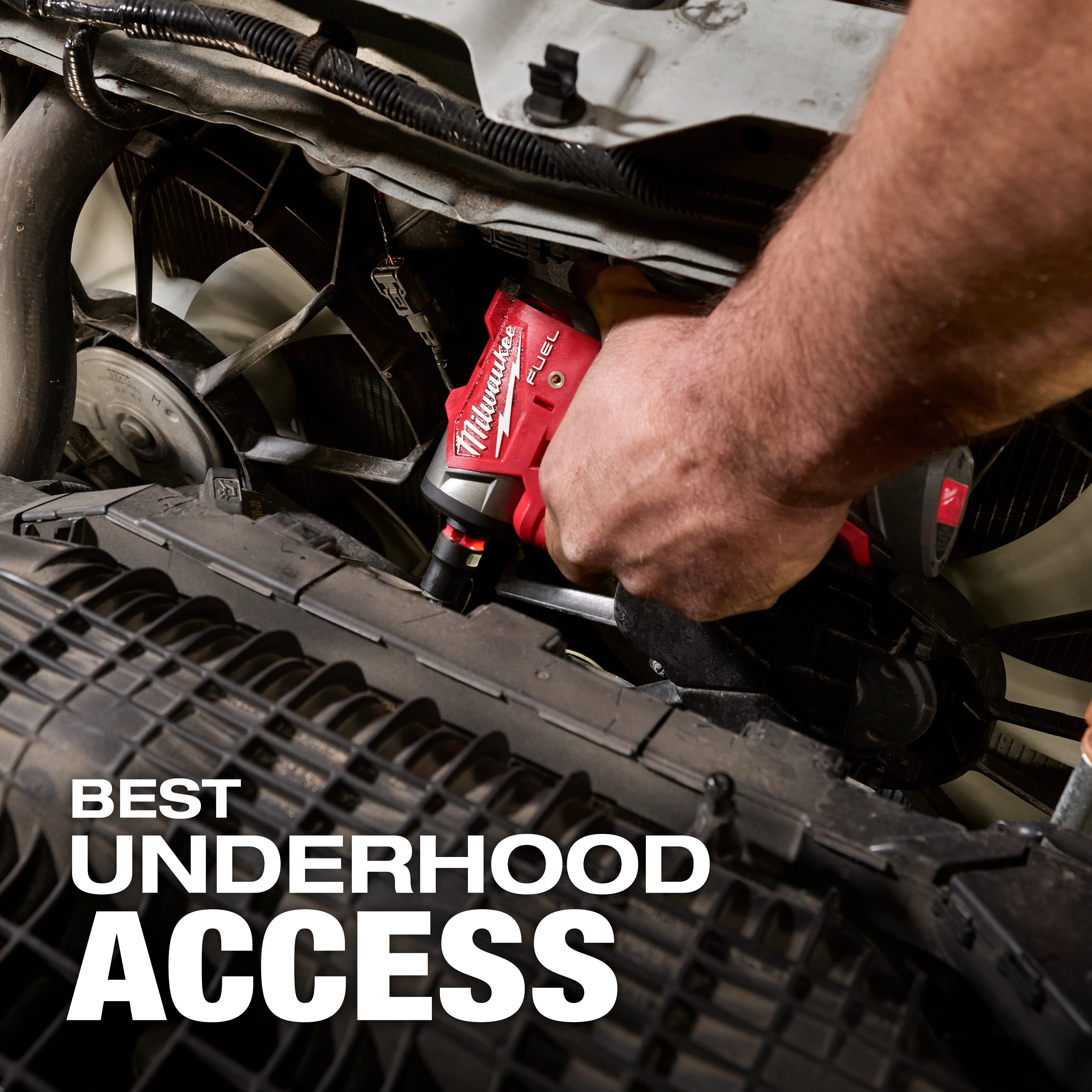 A person uses the M12 FUEL™ 1/4" Subcompact Impact Wrench with Friction Ring to work under the hood of a vehicle. The text "Best Underhood Access" is displayed prominently.