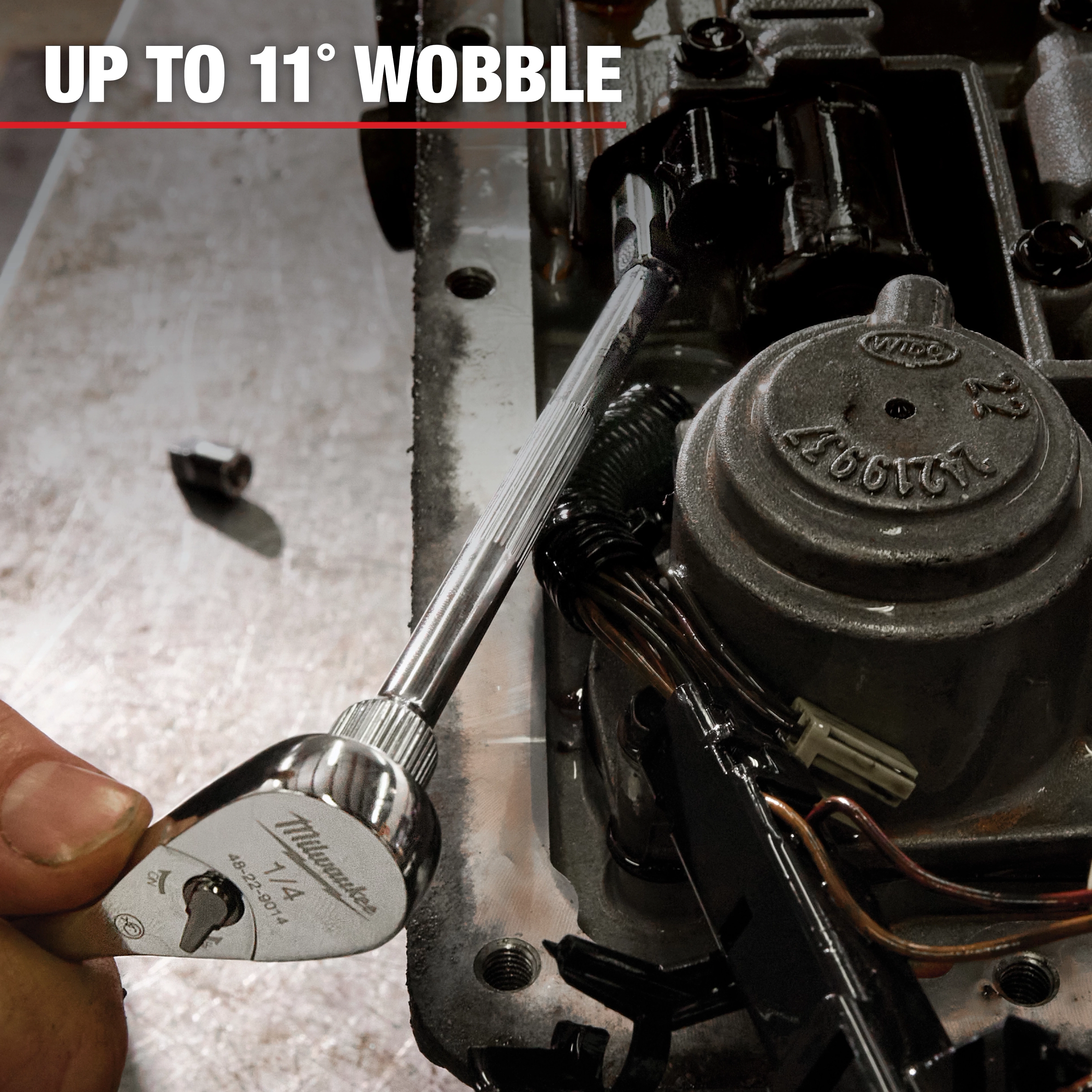 A close-up of a hand using a Milwaukee wrench, part of Mechanic Hand Tools, to tighten a bolt on machinery. The image caption reads "UP TO 11° WOBBLE," indicating the wrench’s flexibility for tight spaces.