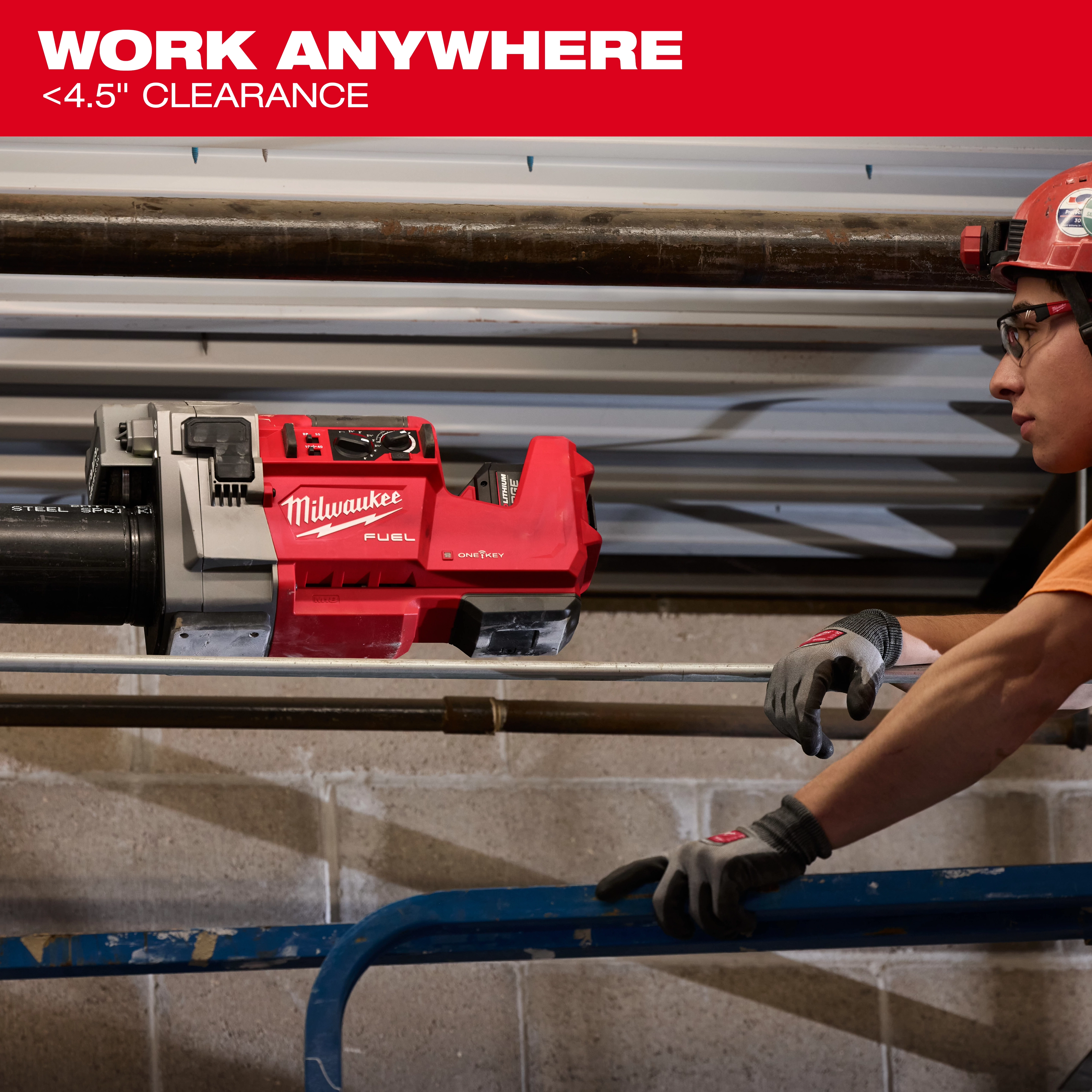 The image shows an M18 FUEL™ RINGER™ Roll Groover by Milwaukee being used on a pipe with under 4.5 inches of clearance.