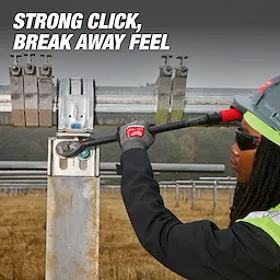 A worker uses the 1/2" Drive Click Torque Wrench (50-250 ft·lbf) on a metal structure outdoors. Text reads "Strong Click, Break Away Feel".
